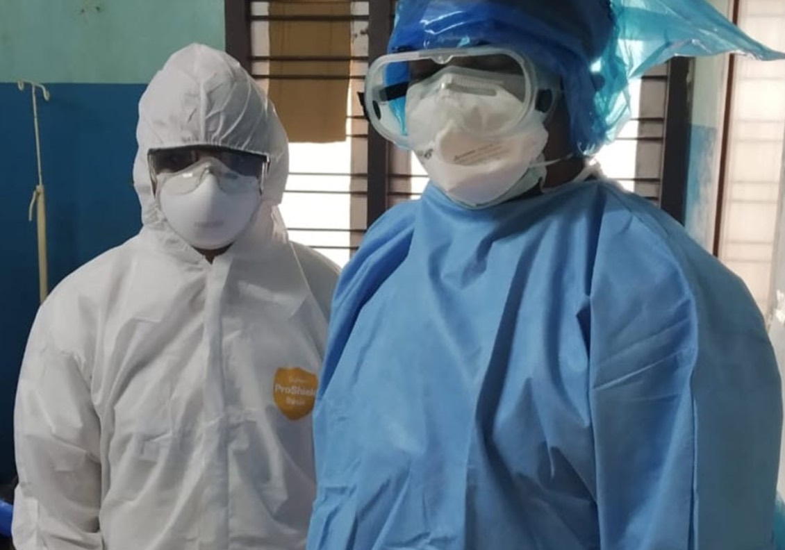 Clinicians wearing personal protective equipment
